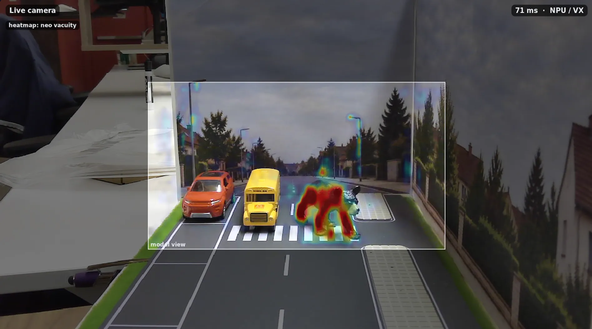 The same scene with the Capsa risk heatmap overlaid: the animal is lit up in red while the vehicles stay clear.