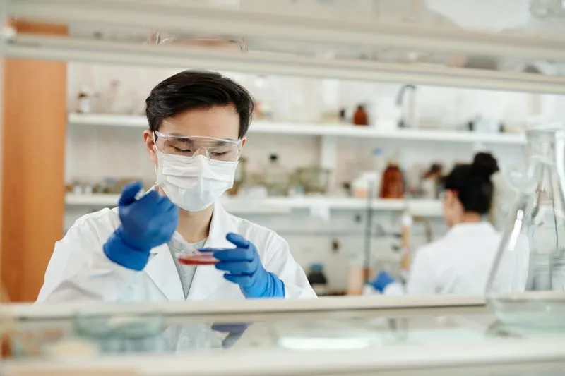 Drug Discovery Cost Reduction with Uncertainty-Guided Predictions